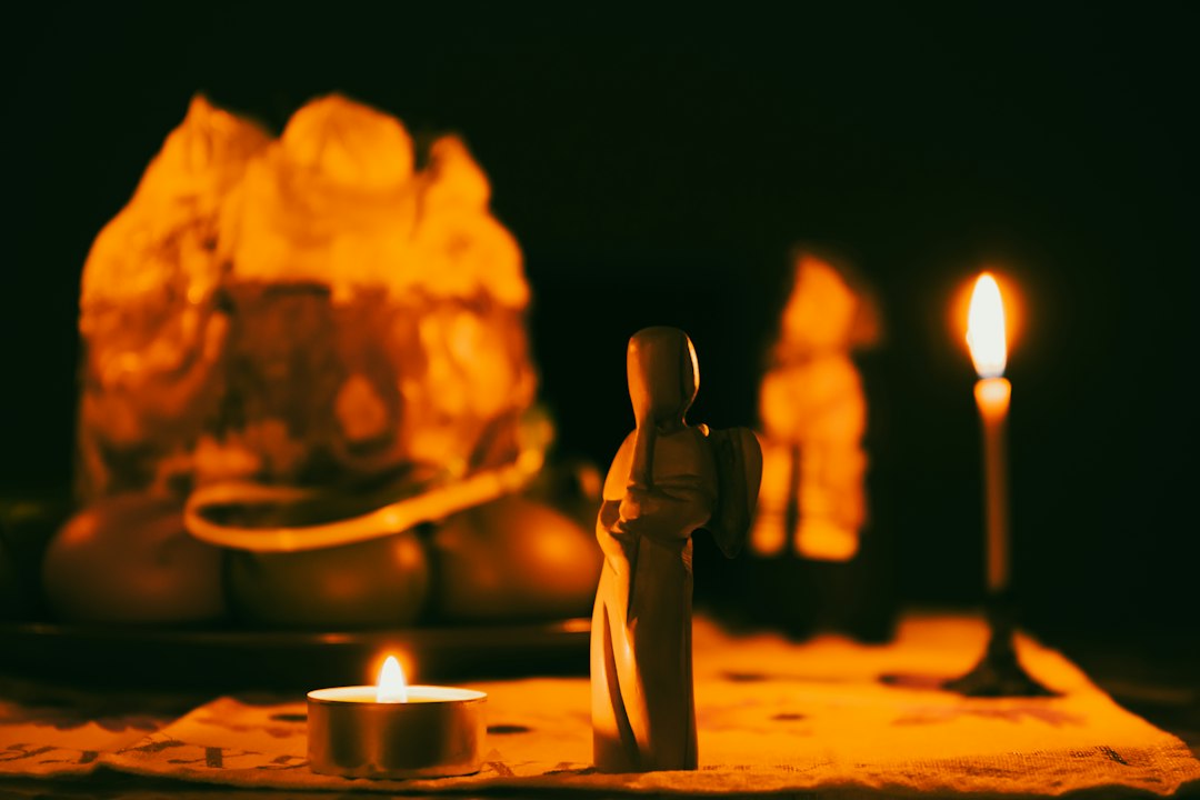 Easter card. Angel plays on the background of Easter cake, candles and icons
