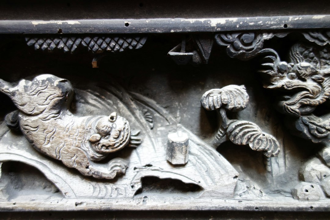 Carved wood features a tiger and dragon