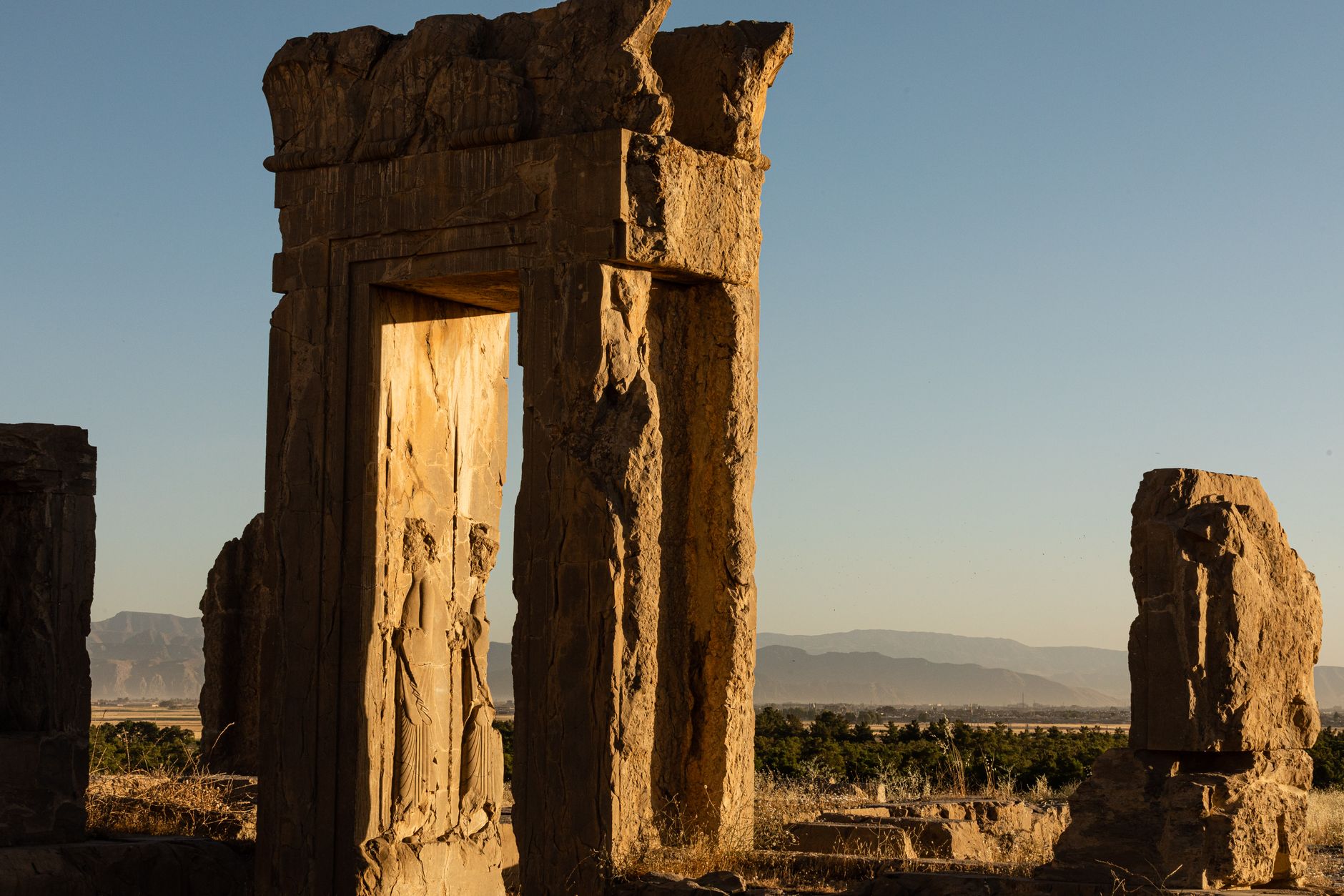 Explore the ancient ruins of Persepolis, Iran, capturing timeless architecture at sunset.